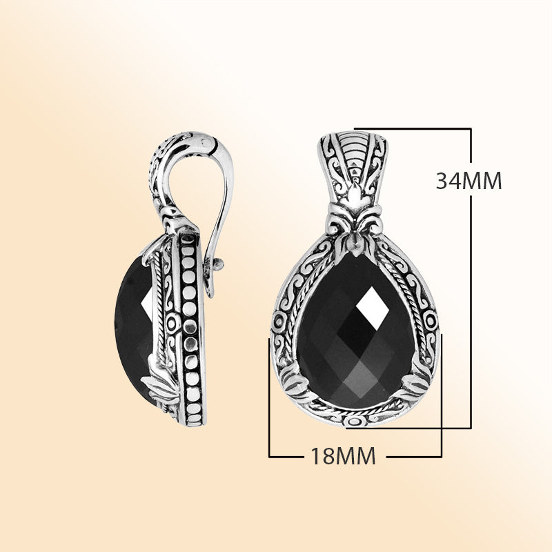 Handcrafted sterling silver pendant featuring a faceted Black Onyx teardrop with artistic Balinese detailing and a polished high-gloss surface.
