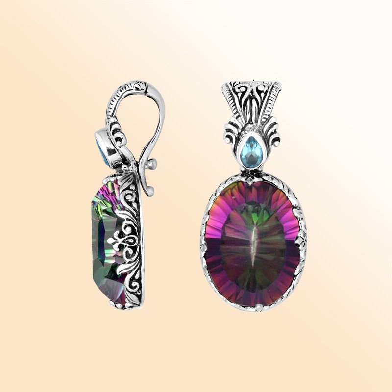 Handcrafted sterling silver pendant featuring Mystic Quartz with Blue Topaz Quartz accent and artistic Balinese detailing.