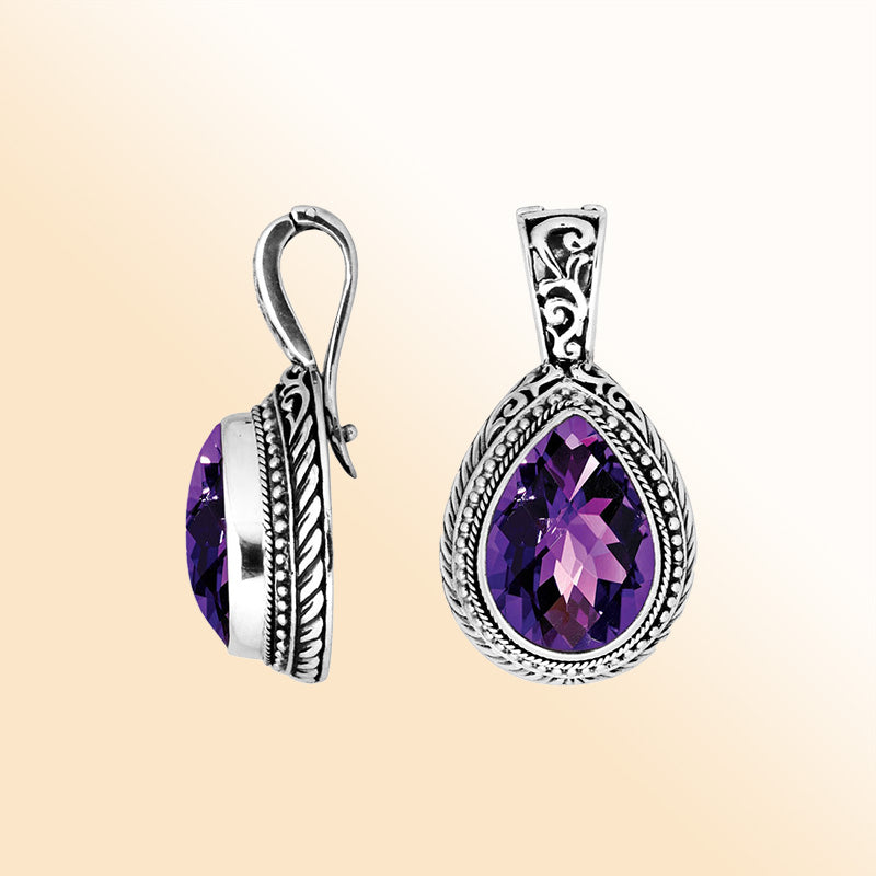 Handcrafted sterling silver teardrop pendant featuring faceted Amethyst Quartz with artistic Balinese detailing and a high-gloss polished finish.