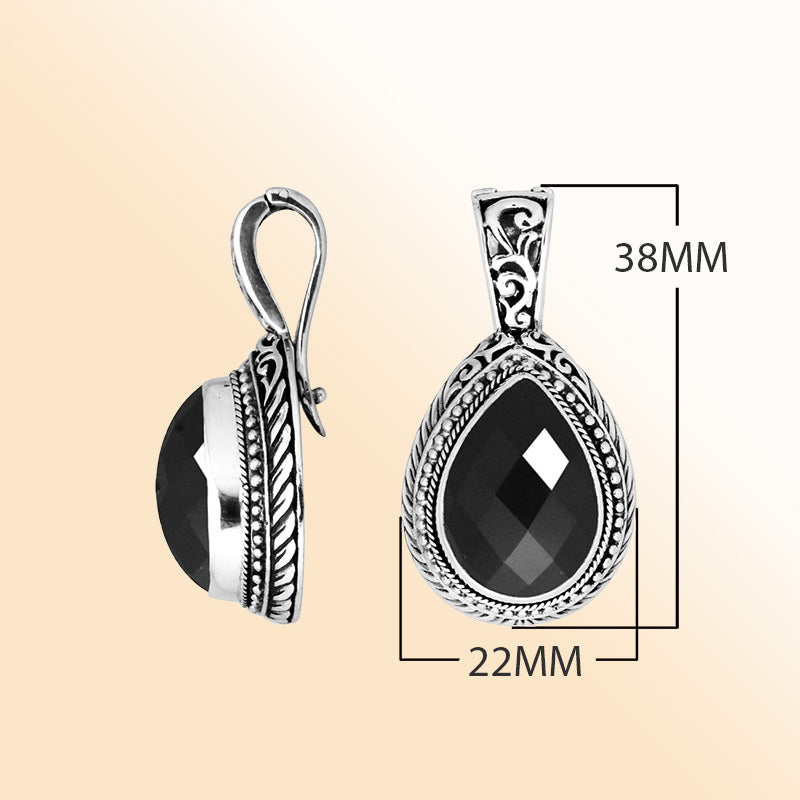 Handcrafted sterling silver teardrop pendant featuring faceted Black Onyx with artistic Balinese detailing and a polished glossy finish.