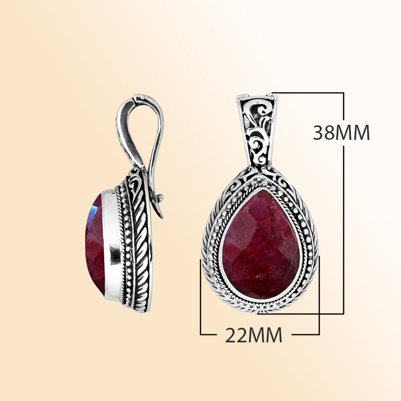Handcrafted sterling silver teardrop pendant featuring Ruby Quartz with artistic Balinese detailing and a high-gloss polished finish.