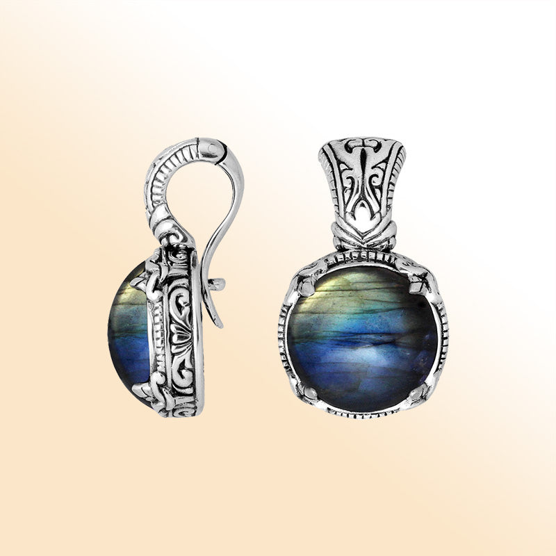 Handcrafted sterling silver cushion pendant featuring Labradorite with artistic Balinese detailing and a polished glossy finish.