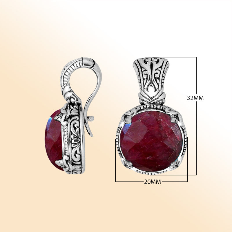 Handcrafted sterling silver cushion pendant featuring vivid Ruby Quartz and artistic Balinese detailing.