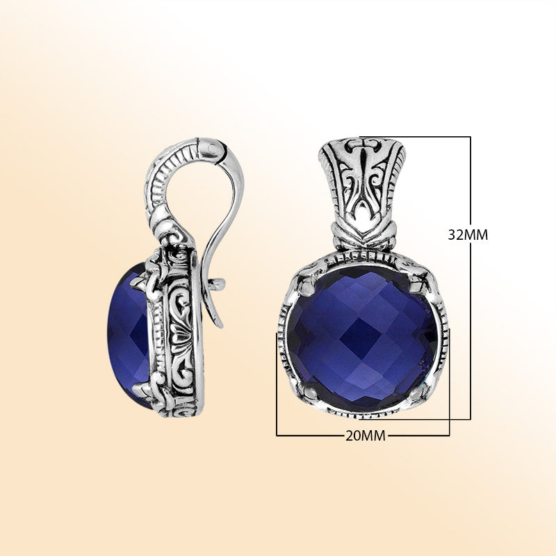 Handcrafted sterling silver cushion pendant featuring deep Sapphire Quartz and artistic Balinese detailing.