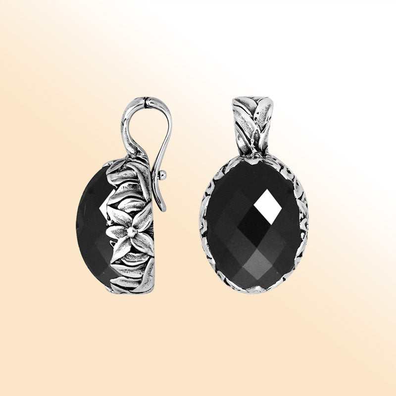 Handcrafted sterling silver pendant featuring faceted Black Onyx with artistic Balinese floral details.
