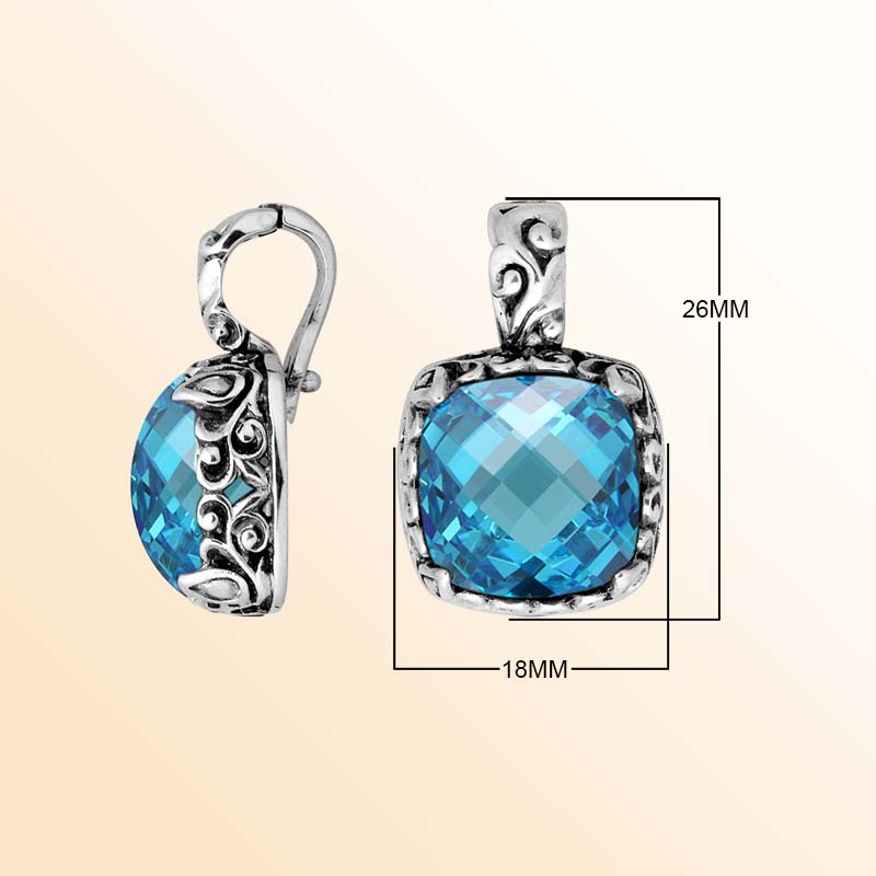 Handcrafted sterling silver pendant featuring Blue Topaz Quartz with artistic Balinese scroll detailing.