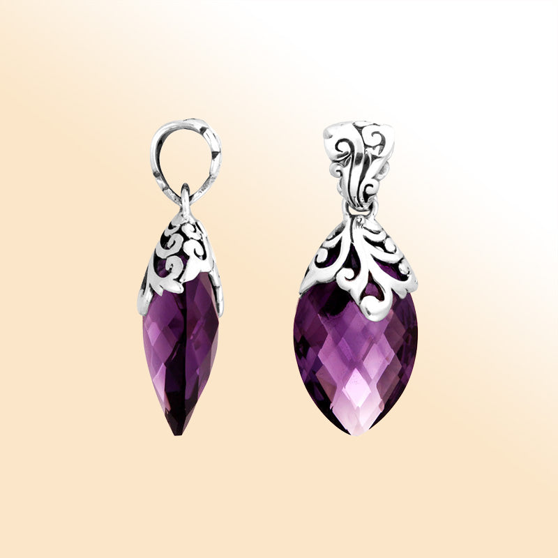 Handcrafted sterling silver marquise pendant showcasing a faceted Amethyst Quartz centerpiece accented with artistic filigree carvings and a polished decorative frame for expressive styling.