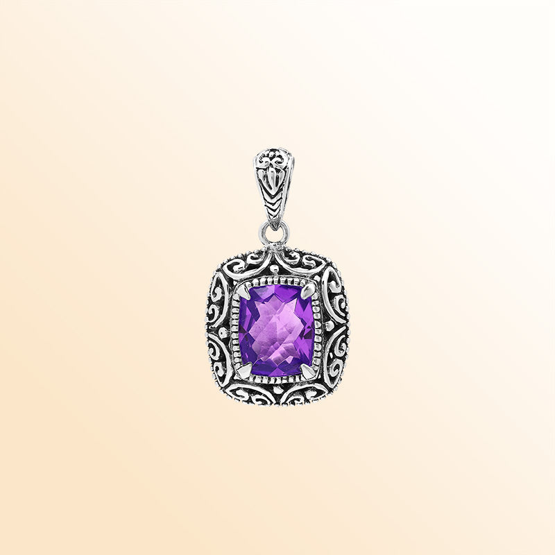 Handcrafted sterling silver cushion pendant featuring a faceted Amethyst Quartz center enriched with artistic Balinese scroll carvings and a polished decorative frame.