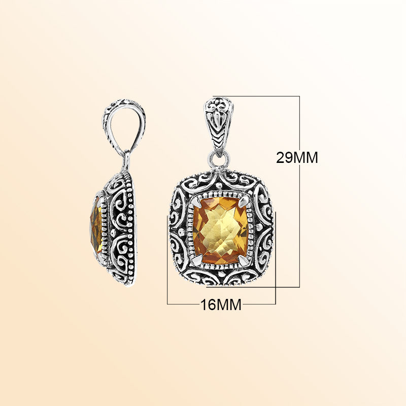 Handcrafted sterling silver cushion pendant featuring a faceted Citrine Quartz center enriched with artistic Balinese scroll carvings and a polished decorative frame.