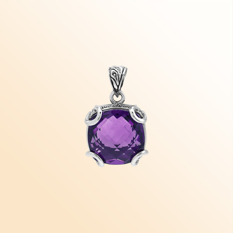 Handcrafted sterling silver cushion pendant featuring a faceted Amethyst Quartz centerpiece held with artistic prong work and fine Balinese carved detailing.