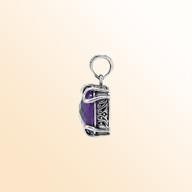 Handcrafted sterling silver cushion pendant featuring a faceted Amethyst Quartz centerpiece held with artistic prong work and fine Balinese carved detailing.