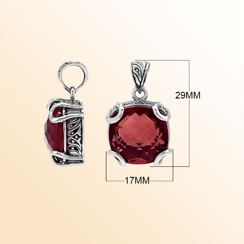 Handcrafted sterling silver cushion pendant featuring a vibrant Red Garnet Quartz centerpiece with expressive prong work and artistic Balinese carved embellishments.