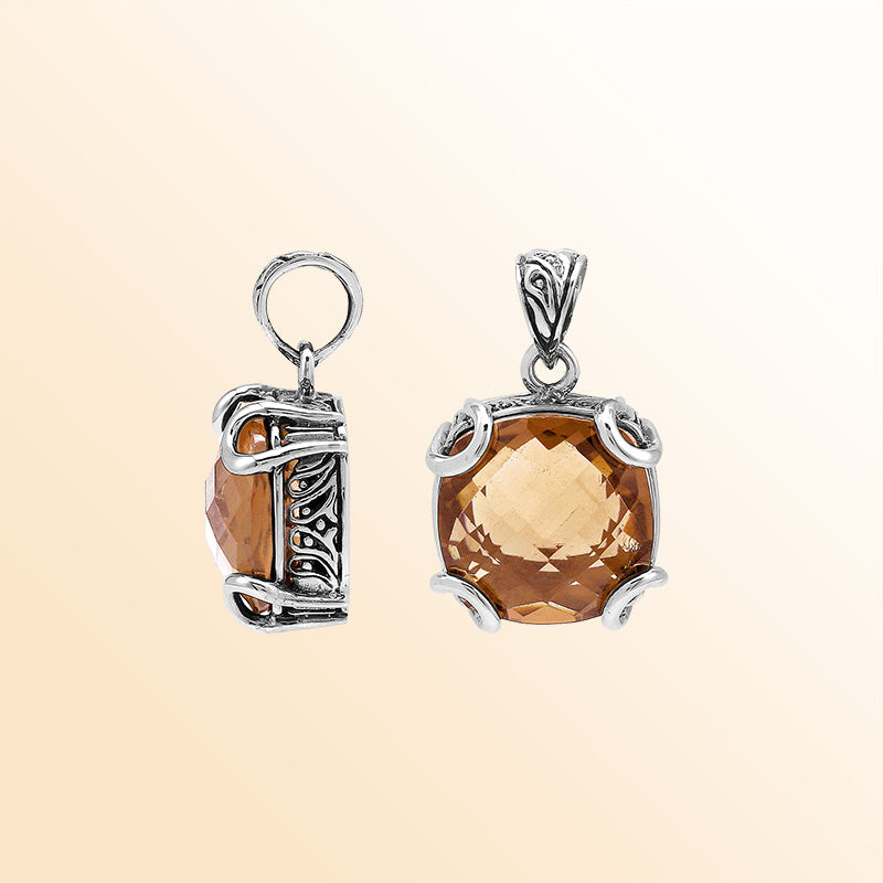 Handcrafted sterling silver cushion pendant featuring a glowing Morganite Quartz centerpiece enhanced with artistic prong work and Balinese carved decorative detailing.