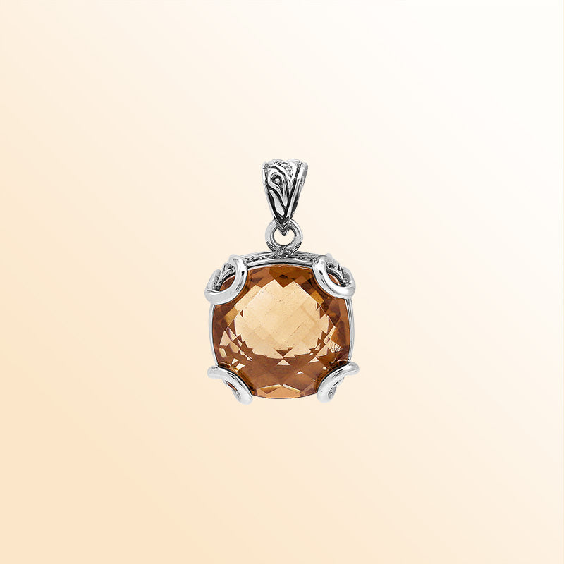 Handcrafted sterling silver cushion pendant featuring a glowing Morganite Quartz centerpiece enhanced with artistic prong work and Balinese carved decorative detailing.