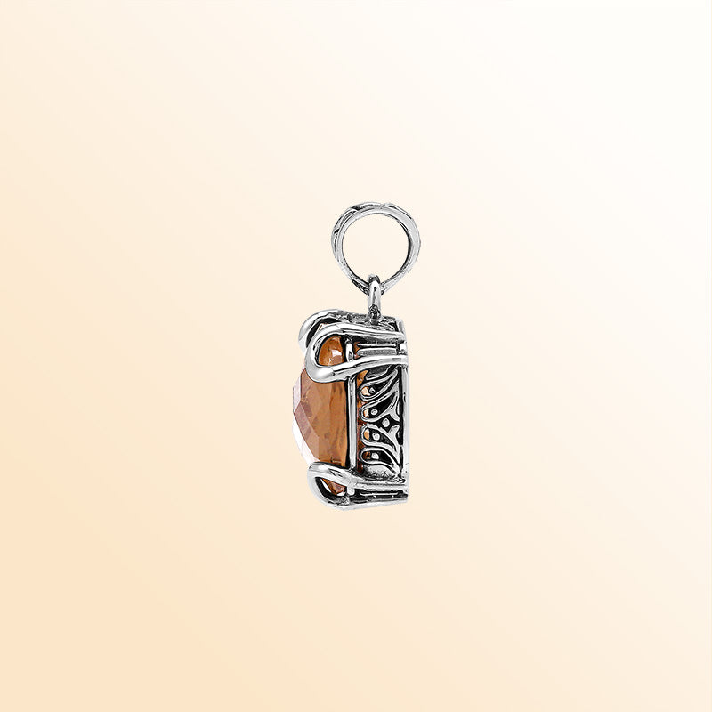 Handcrafted sterling silver cushion pendant featuring a glowing Morganite Quartz centerpiece enhanced with artistic prong work and Balinese carved decorative detailing.