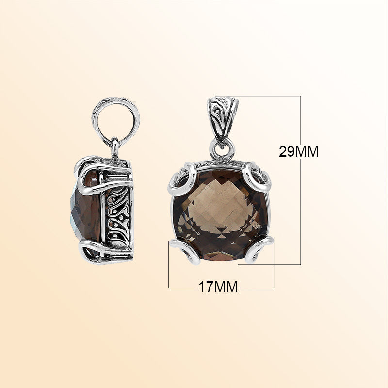 Handcrafted sterling silver cushion pendant featuring a faceted Smokey Quartz centerpiece accentuated with artistic prong work and carved Balinese decorative motifs.