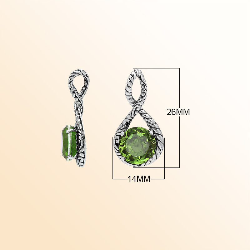 Handcrafted sterling silver twisted loop pendant showcasing a round Peridot Quartz stone with ornate Balinese engraving and polished artistic detailing.