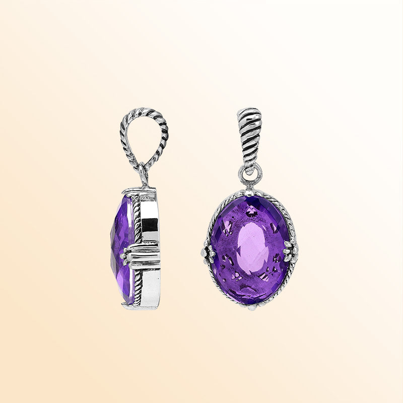 Handcrafted sterling silver oval pendant featuring radiant Amethyst Quartz and rope-textured Balinese detailing.