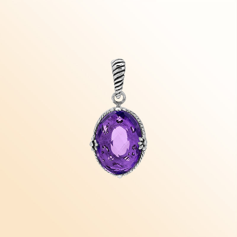 Handcrafted sterling silver oval pendant featuring radiant Amethyst Quartz and rope-textured Balinese detailing.