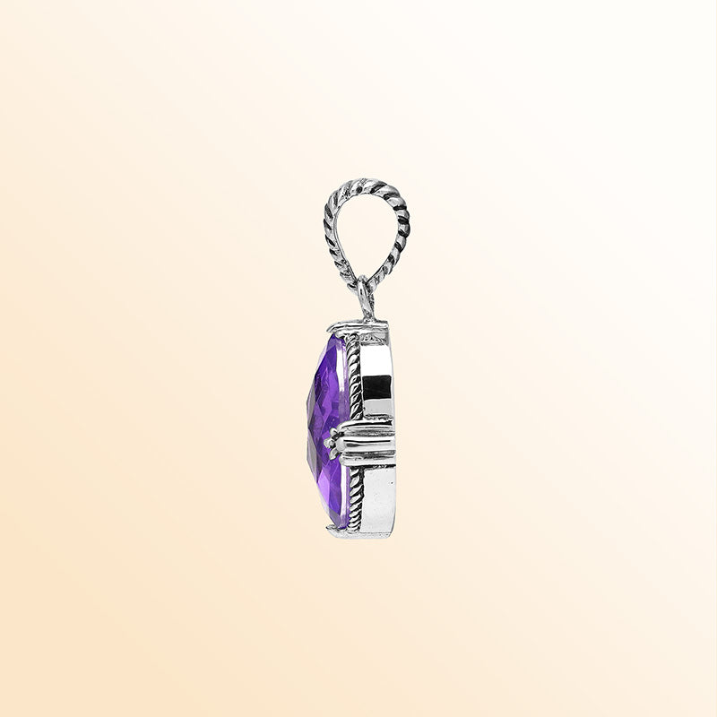 Handcrafted sterling silver oval pendant featuring radiant Amethyst Quartz and rope-textured Balinese detailing.