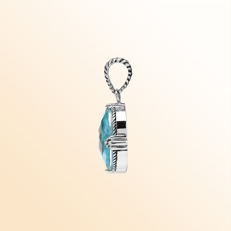 Handcrafted sterling silver oval pendant featuring Blue Topaz Quartz with rope-textured Balinese accents.