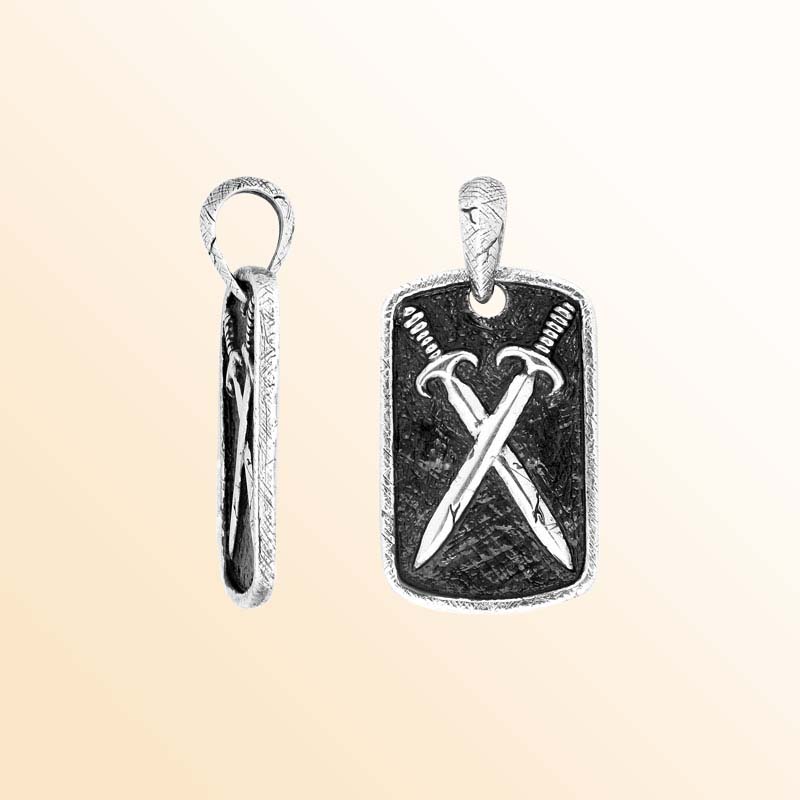 Artistic sterling silver rectangular pendant featuring engraved crossed swords on a textured background with polished edges for a bold modern jewelry style