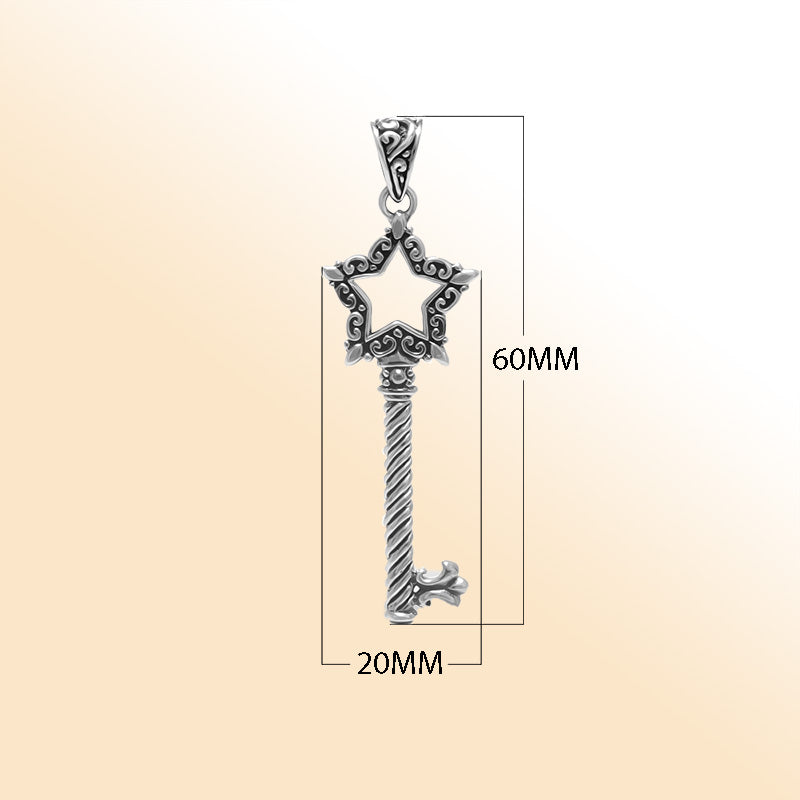 Artistic sterling silver star-shaped key pendant with detailed filigree accents, twisted stem, and polished bright finish for modern expressive jewelry wearers