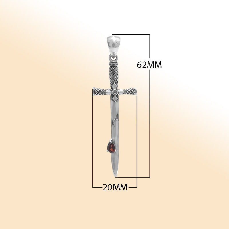 Artistic sterling silver sword pendant featuring teardrop Red Garnet Quartz and carved cross guard details for modern expressive jewelry wearers