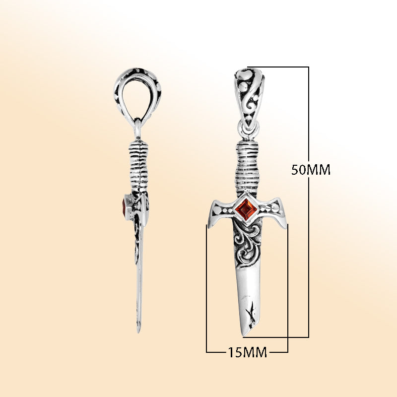 Artistic sterling silver sword pendant featuring carved guard details and a square Red Garnet Quartz accent for modern expressive jewelry wearers