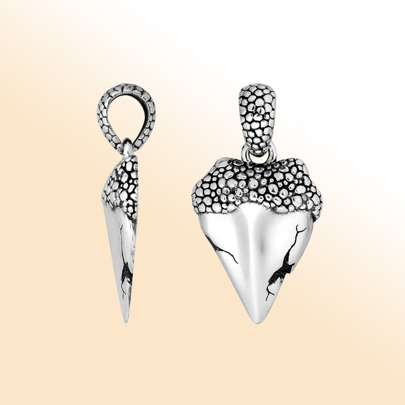 Artistic sterling silver cone pendant with cracked detailing and textured top.