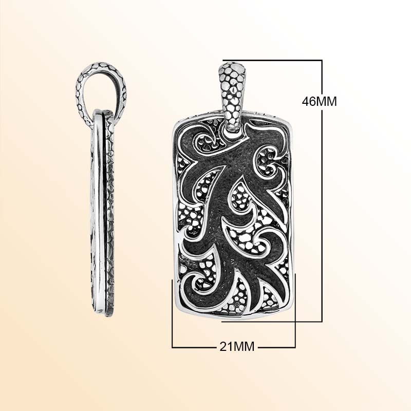 Artistic sterling silver rectangle pendant with swirl carved design and texture.