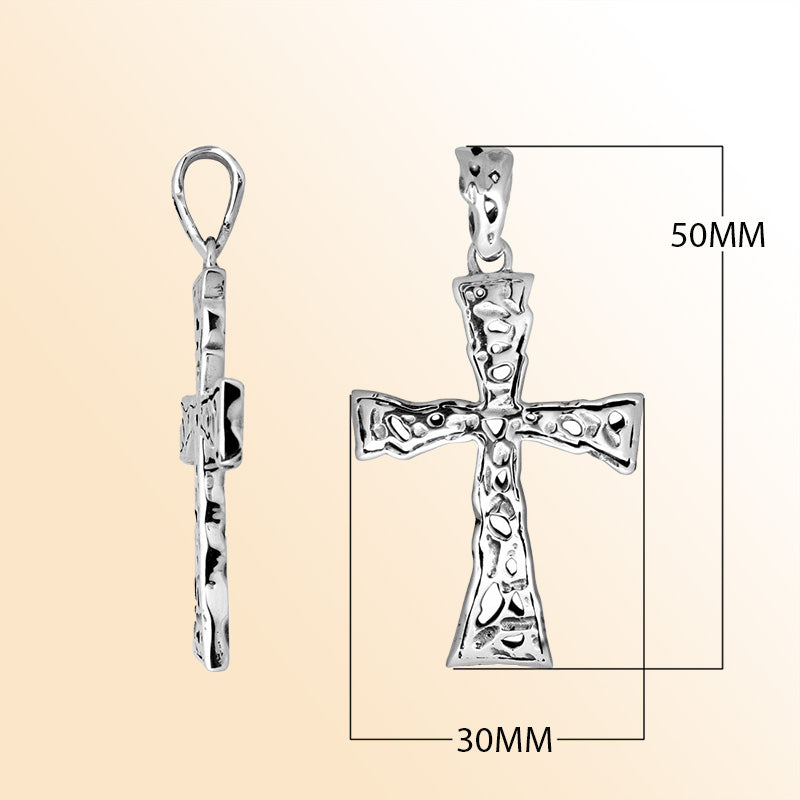 Artistic sterling silver hammered cross pendant with raised detailing.