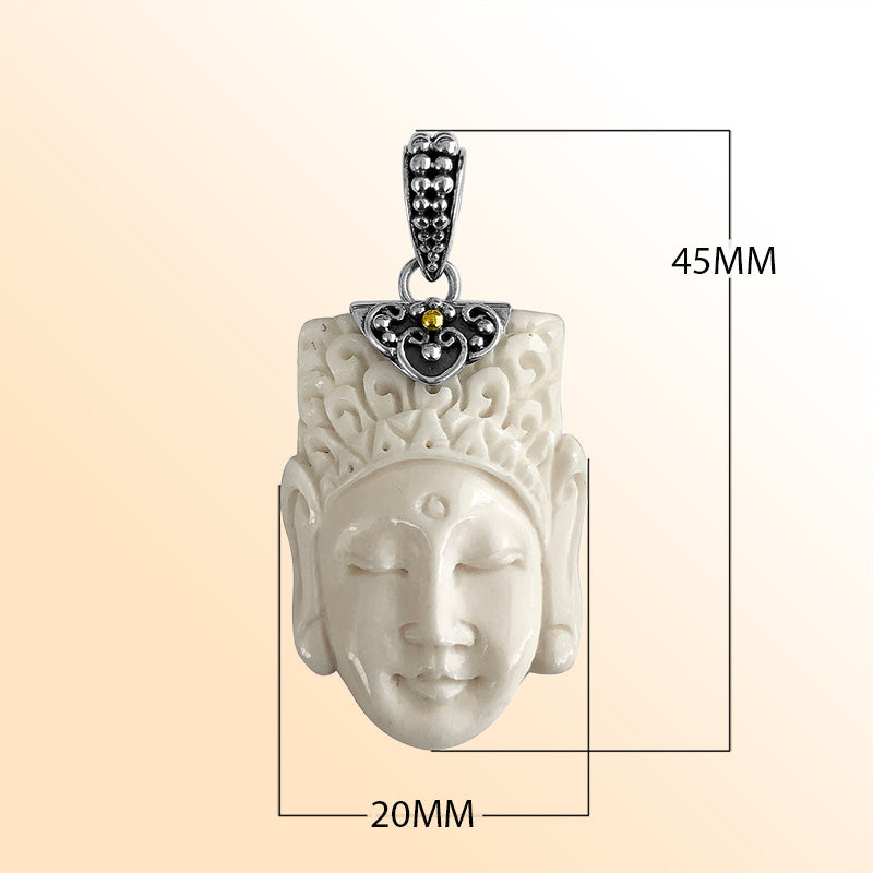 Artistic sterling silver pendant with hand-carved bone face and ornate accents.