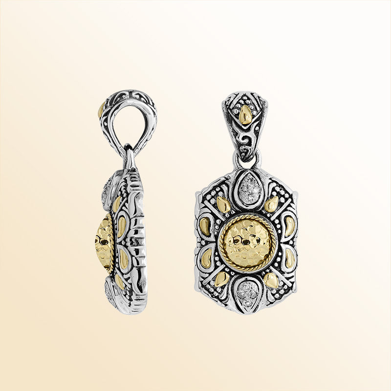 A handcrafted sterling silver and 18K gold pendant featuring a hammered gold sunburst center, diamond accents, intricate Balinese patterns, and antique finishing for expressive everyday elegance.