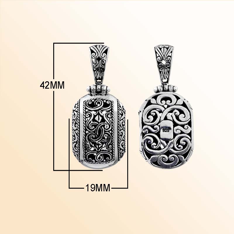 A handcrafted Silver Overlay Over Copper oval pendant showcasing ornate Balinese scrollwork, oxidized antique detailing, polished silver overlay, and traditional artistry ideal for expressive everyday or occasion wear.