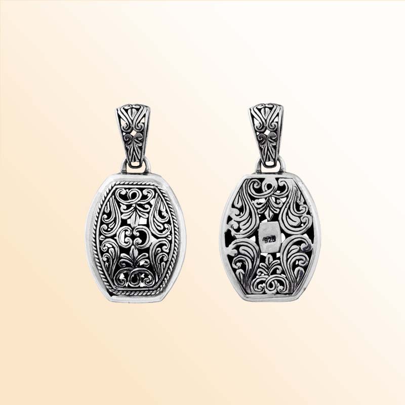 A handcrafted Silver Overlay Over Copper oval pendant featuring ornate Balinese scroll filigree, oxidized textures, polished silver overlay, and artistic detailing perfect for elegant everyday wear.