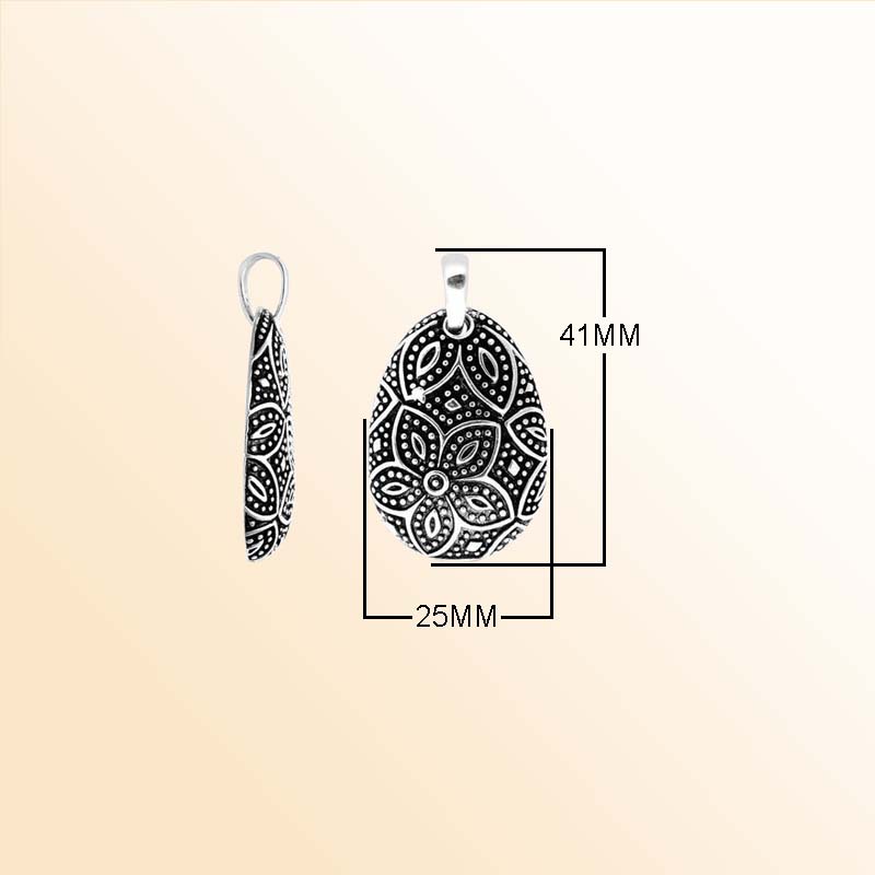 A handcrafted Silver Overlay Over Copper pendant featuring floral etched motifs, dotted detailing, oxidized Balinese textures, and polished overlay artistry perfect for elegant everyday wear.