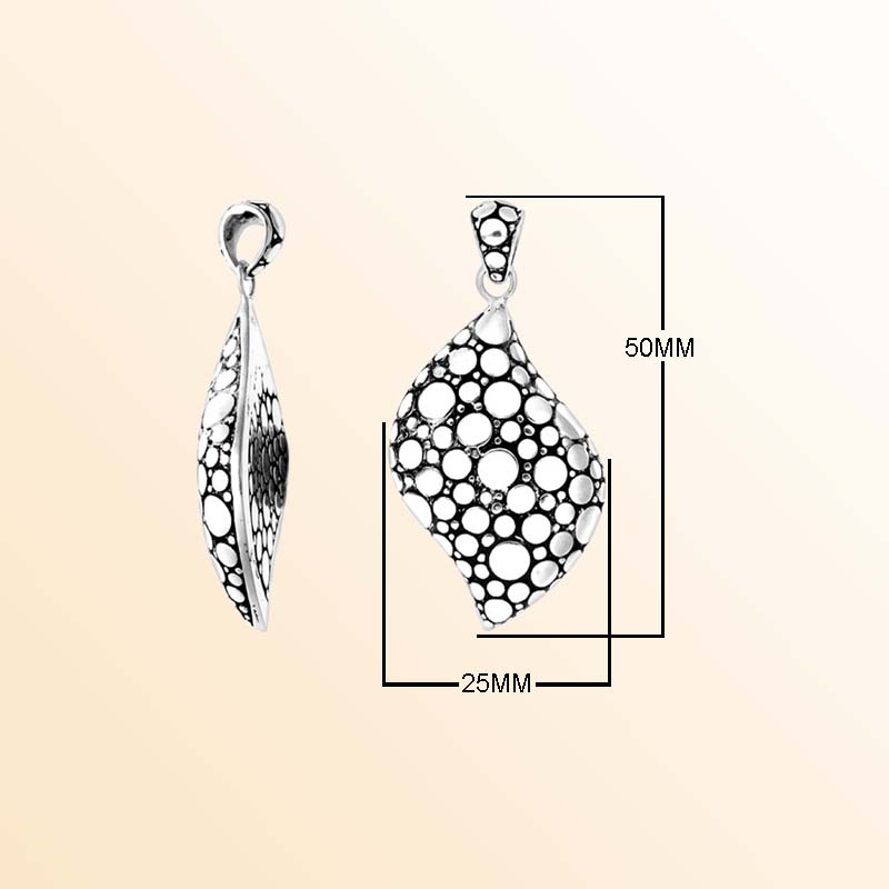 A handcrafted Silver Overlay Over Copper pendant featuring a modern wave shape with artistic bubble cutout patterns, oxidized detailing, and a polished Balinese silver overlay finish.