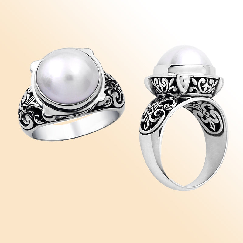 Handmade sterling silver ring with white Mabe Pearl and Balinese filigree design – elegant artisan jewelry for women.