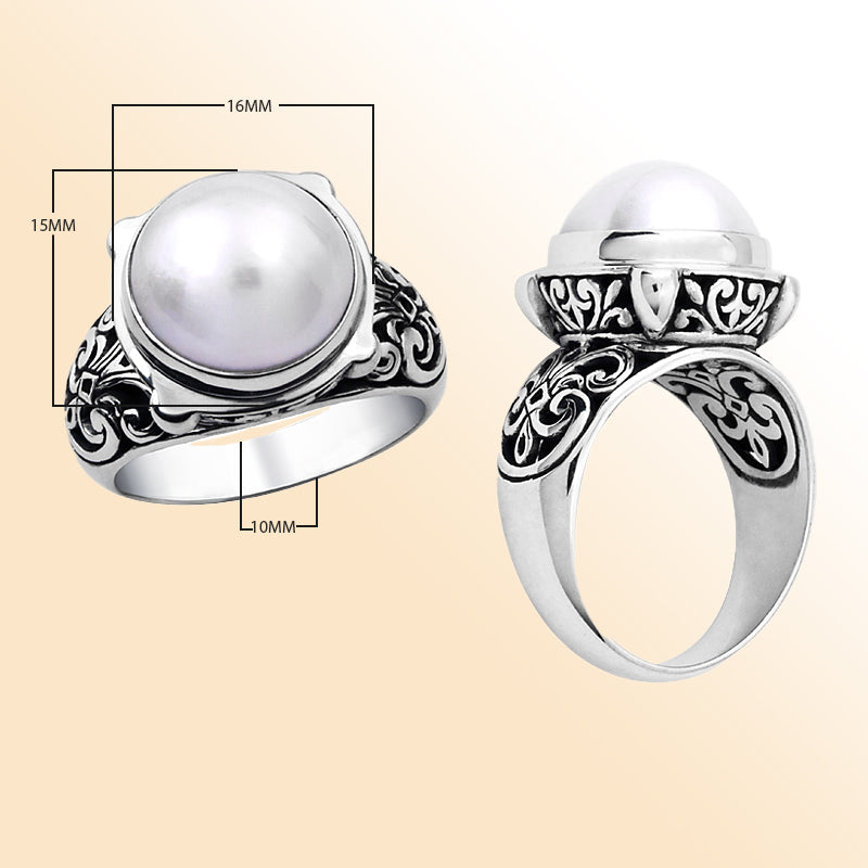 Handmade sterling silver ring with white Mabe Pearl and Balinese filigree design – elegant artisan jewelry for women.