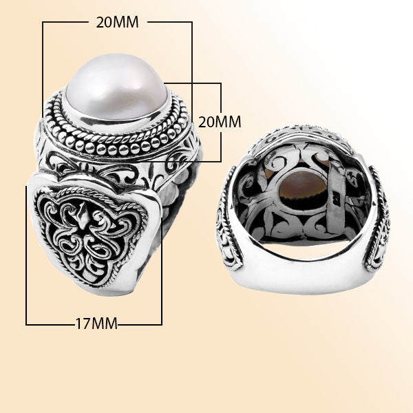 Handcrafted sterling silver Bali ring with luminous white Mabe Pearl and detailed scrollwork design.