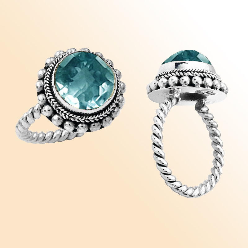 Handcrafted sterling silver Bali ring with faceted Blue Topaz Quartz and twisted rope band design.