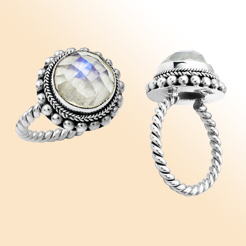 Handcrafted sterling silver Bali ring with faceted Rainbow Moonstone and twisted rope band design.