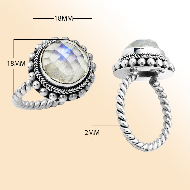 Handcrafted sterling silver Bali ring with faceted Rainbow Moonstone and twisted rope band design.
