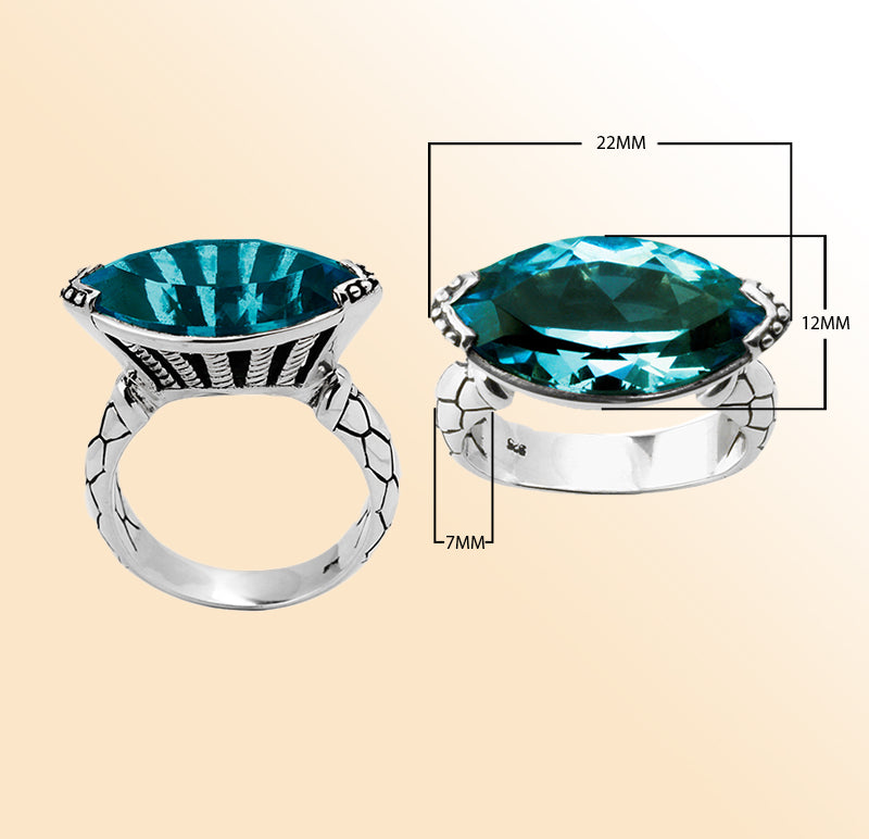Sterling silver marquise-cut blue topaz ring with artisan details – elegant statement jewelry for women.