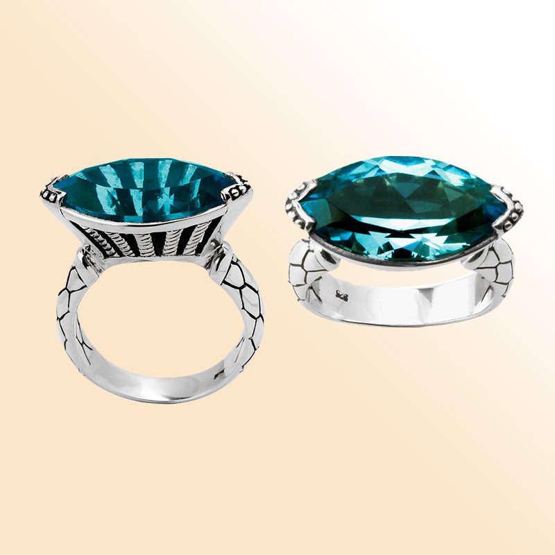 Sterling silver marquise-cut blue topaz ring with artisan details – elegant statement jewelry for women.