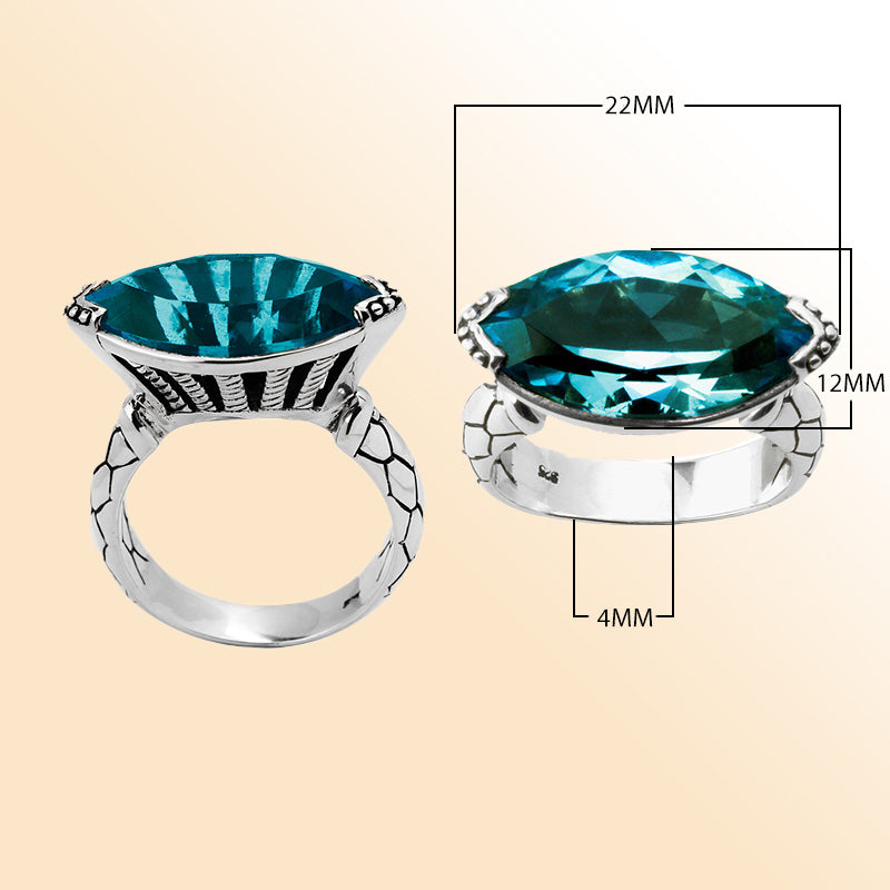 Sterling silver marquise-cut blue topaz ring with artisan details – elegant statement jewelry for women.
