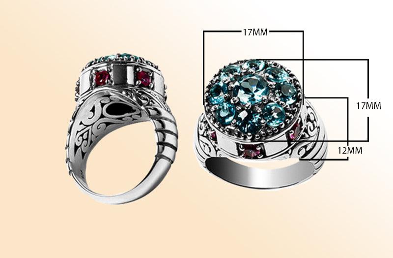 Sterling silver cluster ring with sparkling blue topaz quartz and ruby accents – bold artisan statement jewelry for women.