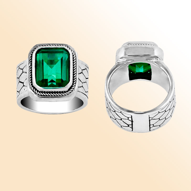 Men’s sterling silver ring with bold emerald-green stone and textured band – stylish statement jewelry gift for him.