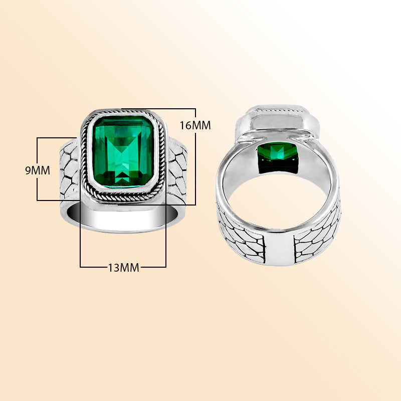 Men’s sterling silver ring with bold emerald-green stone and textured band – stylish statement jewelry gift for him.